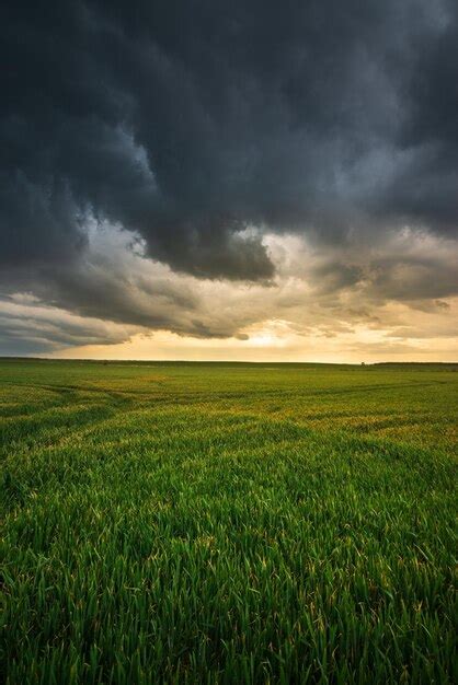 Premium Photo | Storm clouds dramatic dark sky over the rural field ...