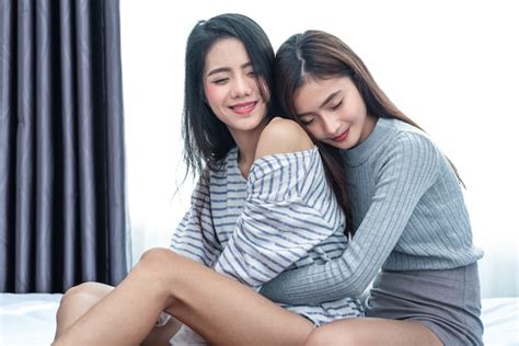 Premium Photo Two Asian Lesbian Women Hug And Embracing Together In