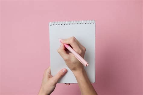 Premium Photo Female Hands Write With A Pen In A Notebook