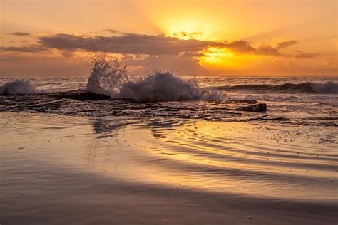 Ocean Waves Crashing On Shore During Sunset Stock Photo At Vecteezy