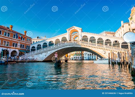 Traditional Gondola Near World Famous Canal Grande And Rialto Bridge