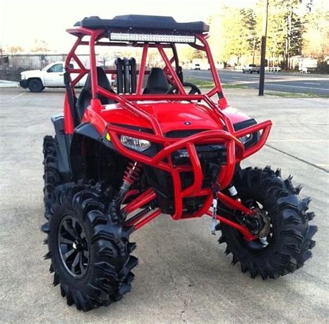 Red RZR Four Wheeled Off Road Vehicle