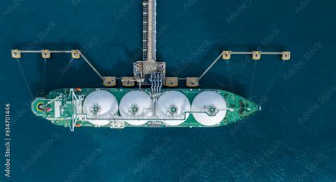 LNG (Liquified Natural Gas) tanker anchored in Gas terminal gas tanks ...