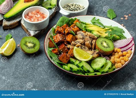 Healthy Vegetable Lunch In A Buddha Bowl With Tofu Avocado Chickpeas Cucumber And Mushrooms