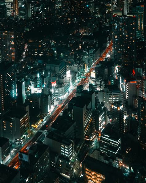 Aerial View Of City Buildings During Night Time Hd Phone Wallpaper