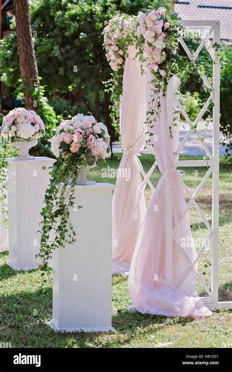 Arch For The Wedding Ceremony Decorated With Cloth And Flowers Stock