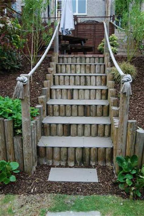 Logs Used As A Retaining Wall Steps And Supporting A Rope Handrail