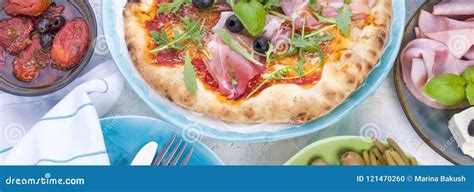 Italian Food on the Table, Pizza and Antipasto. Beautiful Serving for a ...