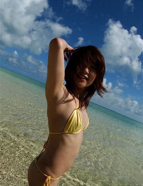 Hot Asian Girl In A Yellow String Bikini Takes It All Off While Walking