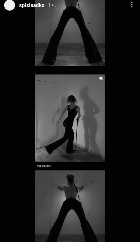 A Woman In Black Is Dancing With Her Legs Spread Out