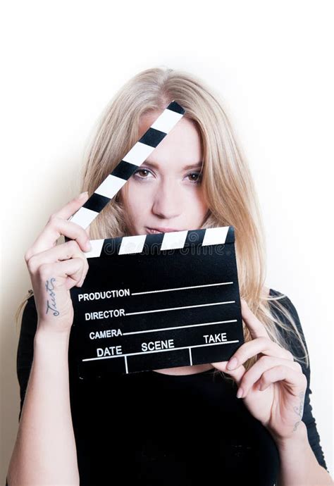 Young Actress Audition Posing With Movie Clapper Board Stock Photo