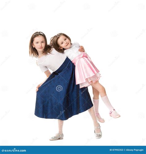 Two Sisters in Holiday Dresses Stock Image - Image of person, baby ...