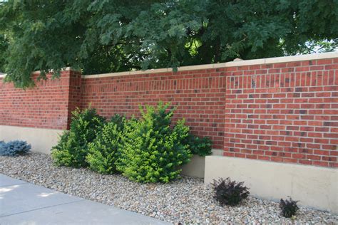 Red Brick Retaining Wall | Brick wall gardens, Brick fence, House fence ...