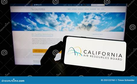 Person Holding Mobile Phone With Logo Of California Air Resources Board