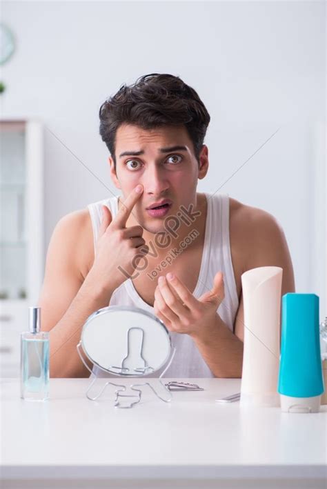 Young Handsome Man Staring At His Reflection In A Mirror Picture And Hd