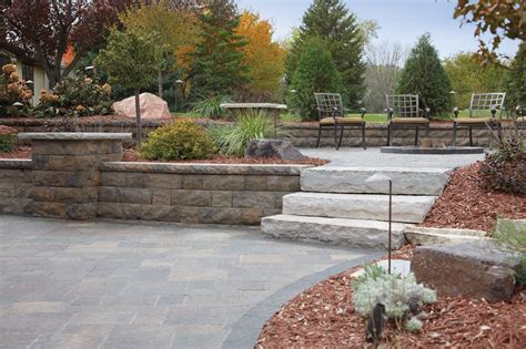 Raised Patio With Elevated Planting Areas Made From Artisana