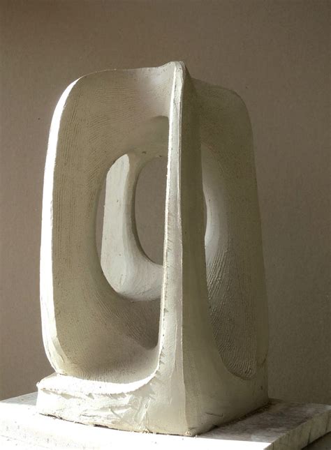 A White Sculpture Sitting On Top Of A Table