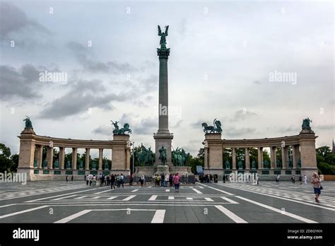 Tourists Gather At The Millennium Monument In Heros Square In Budapest