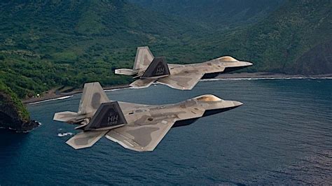 Extreme Closeup Of F 22 Raptors In Close Formation Over Mount Fuji Is