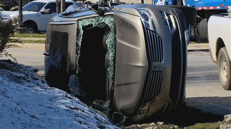 Vehicle ends up on its side after crash with garbage truck; No injuries reported | WLOS