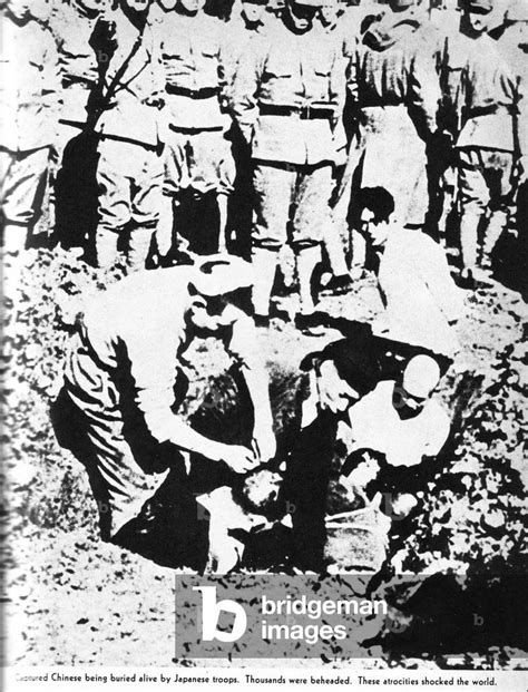 A Captured Chinese Soldier Being Buried Alive By Japanese Troops By