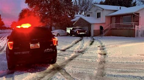 Police Warn Of Icy Roads After Pickup Slides Into Garage Of Roy