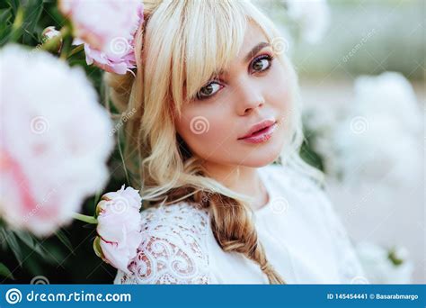 Outdoor Close Up Portrait Of Beautiful Young Woman In The Blooming