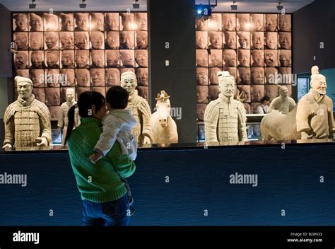 Tourists View Terracotta Warriors On Display In The Shaanxi History