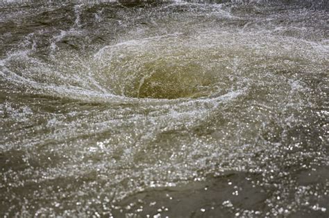 Whirlpool in the Center of a River Stock Image - Image of swirl, twirl ...