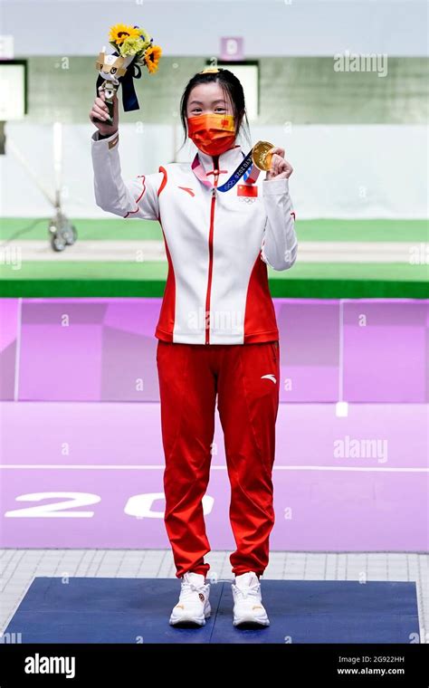 China S Qian Yang Celebrates With Her Gold Medal After Winning The 10m