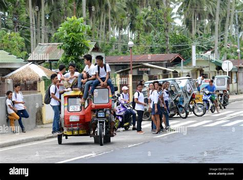 School Students Riding A Tricycle In Sorsogon Province In The