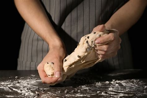 Premium Photo Woman Kneading Dough On Table