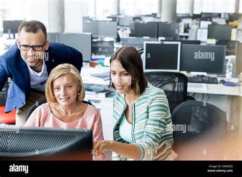 Business people working at computer in office Stock Photo - Alamy