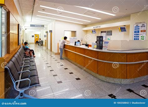 SEOUL, KOREA - AUGUST 12, 2015: One Lady Waiting at Registration Desk ...