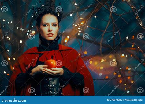 Evil Queen Holding A Red Poisonous Apple As Bait Stock Image Image Of