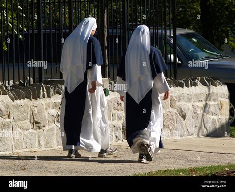 Two Nuns Donning Traditional Catholic Habits With Sneakers Out For An