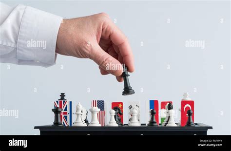 Politicians Hand Moves A Chess Piece Conceptual Photo Of A Political