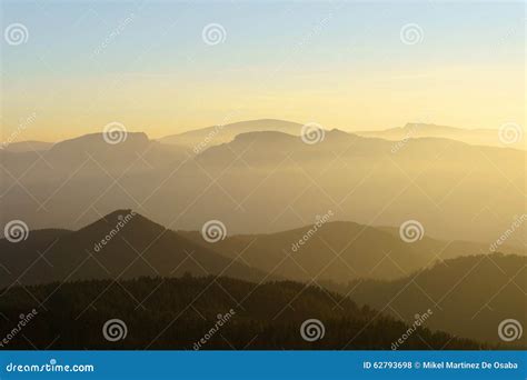 Mountain Silhouettes At Sunset With Haze Stock Photo Image Of Scenery