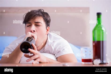 The Man Alcoholic Drinking In Bed Going Through Break Up Depression