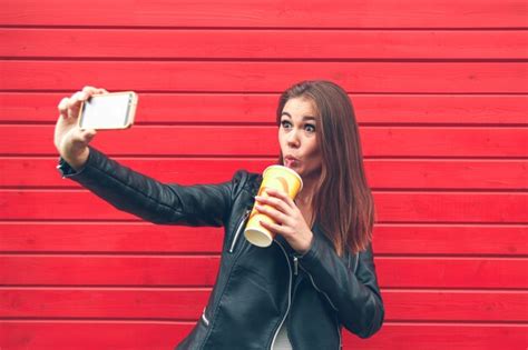 Premium Photo Young Woman Holding A Mobile Phone In Hands