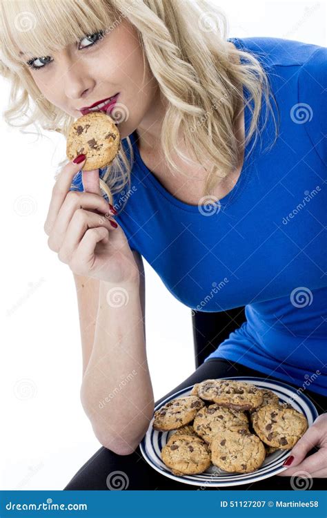 Young Woman Eating A Chocolate Chip Cookie Biscuit Stock Image Image