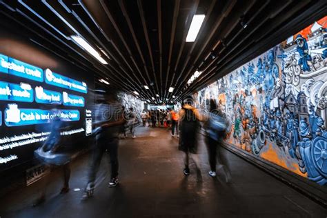 Long Exposure Of People Walking In The Underpass With Graffiti Art On Its Walls Editorial Stock