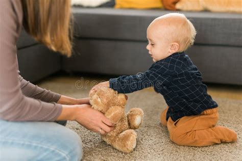 Child Playing With Teddy Bear Little Boy Hugging His Favorite Toy At