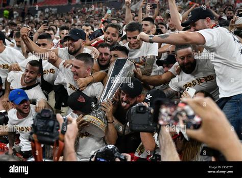 Sevilla's supporters celebrate with the trophy after their team won the Europa League final ...