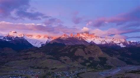 Mount Fitz Roy In Clouds At Sunrise Hills And Snow Capped Mountains