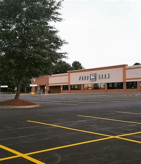 CHARLOTTE PARKING LOT AND ASPHALT MAINTENANCE Parking Lot Striping