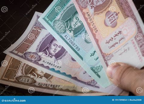 Mongolian Currency Tugrik Money Various Banknotes Held In The Hand