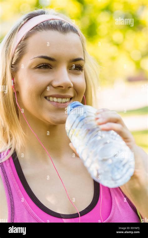 Fit Blonde Drinking From Her Water Bottle Stock Photo Alamy