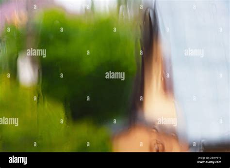 View Through A Wet Window Glass In The Rain Blurred Image Home Garden