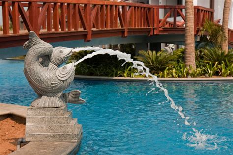 Incorporating Art And Sculptures Into Pool Landscapes Tiki Pools